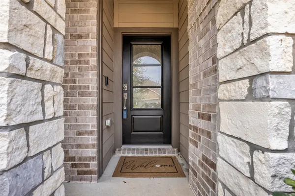 a view of a door and wooden floor