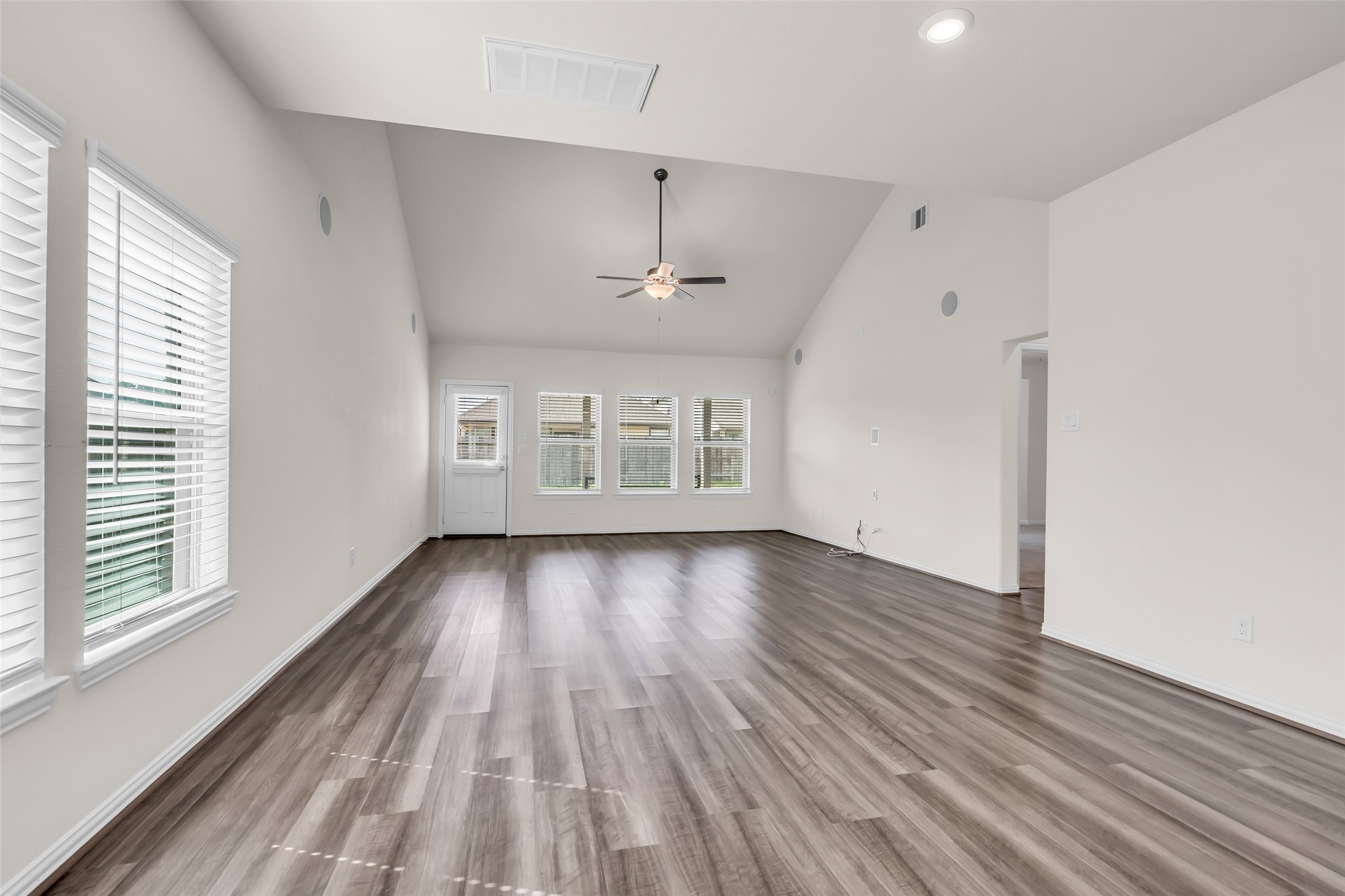 28130 Aspen Horizon Drive Spring, TX 77386 - Photo 11 of 39 a view of an empty room with wooden floor and a window