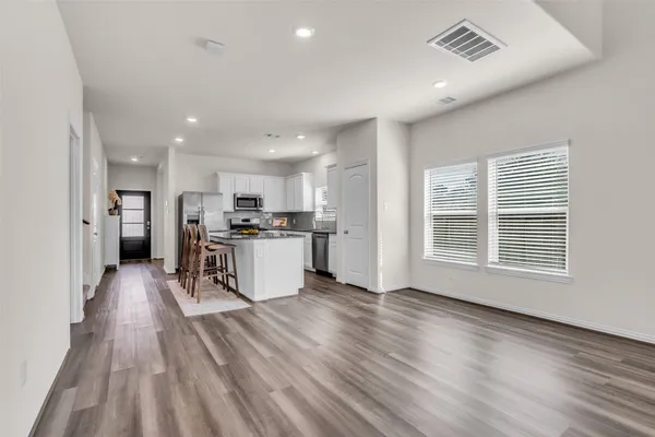 a view of kitchen with wooden floor