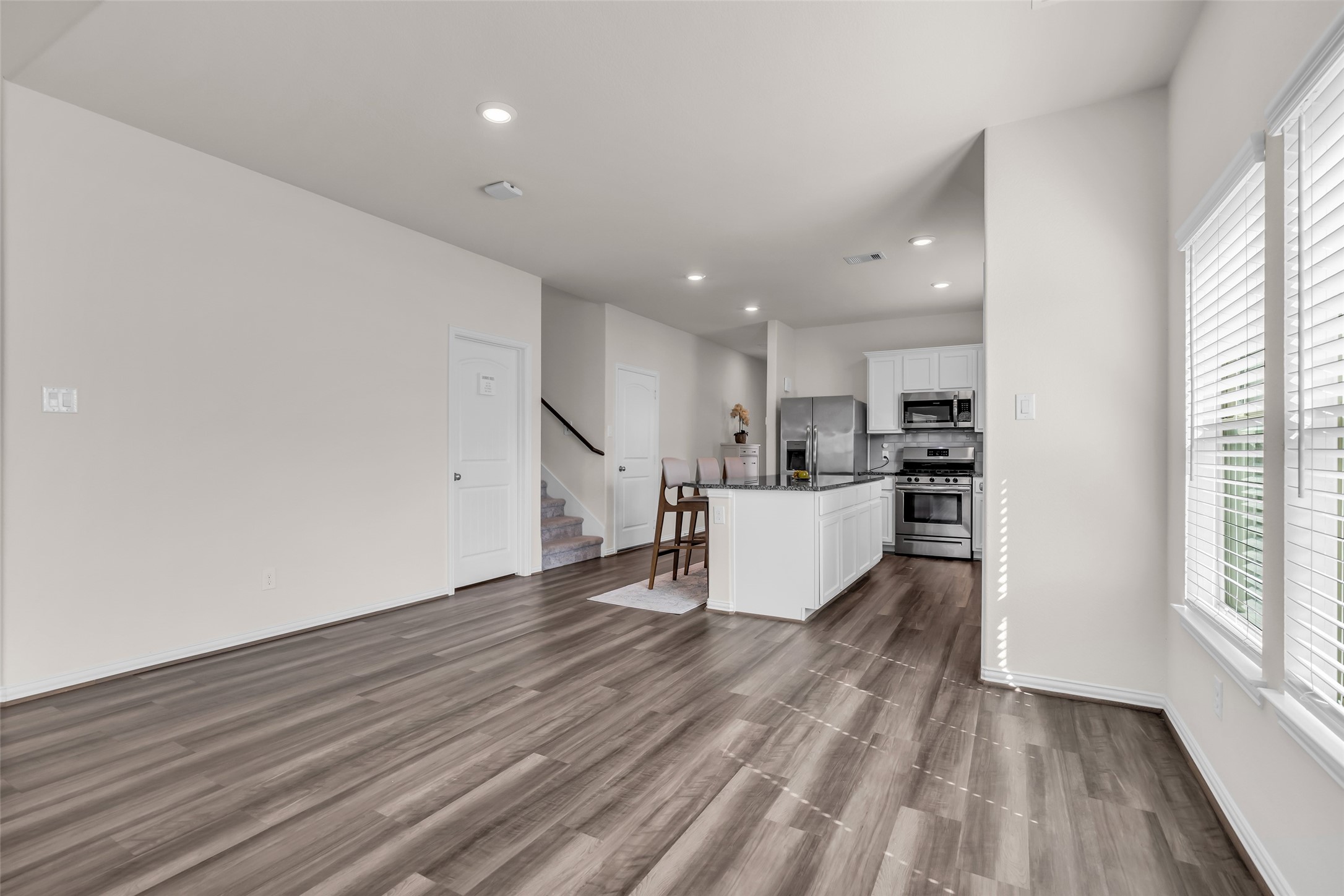 28130 Aspen Horizon Drive Spring, TX 77386 - Photo 14 of 39 a view of kitchen with wooden floor and window