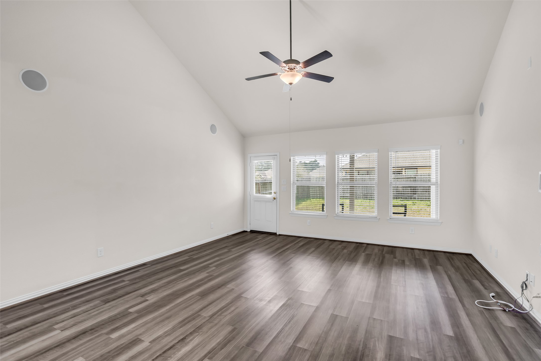 28130 Aspen Horizon Drive Spring, TX 77386 - Photo 17 of 39 a view of an empty room with wooden floor and a window
