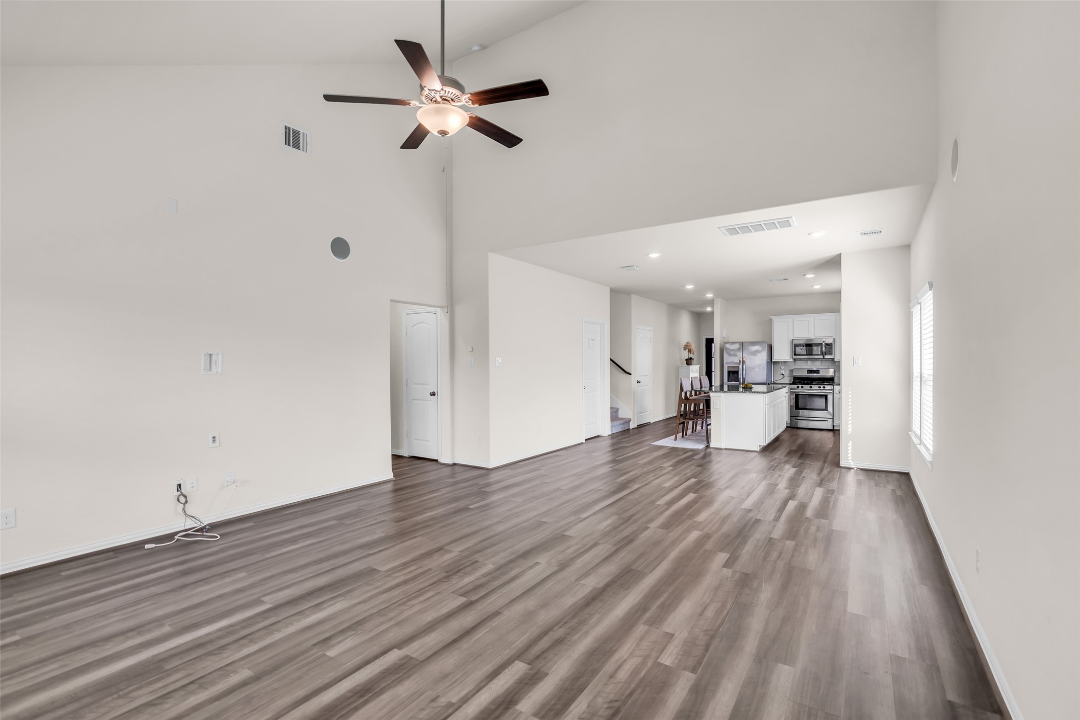 28130 Aspen Horizon Drive Spring, TX 77386 - Photo 18 of 39 a view of a room with wooden floor and a ceiling fan
