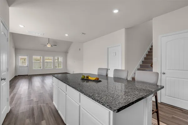 a kitchen with sink and cabinets