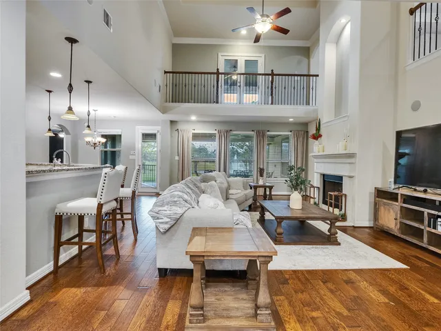 a living room with fireplace furniture and a flat screen tv