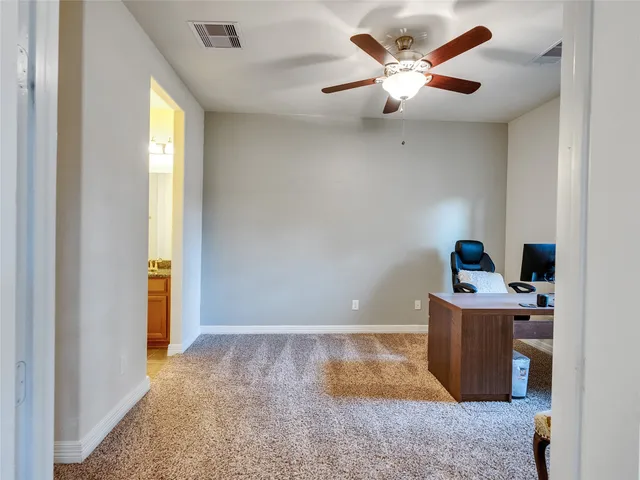 a living room with a couch and a window