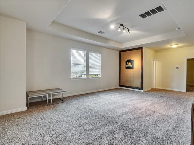 a bedroom with bed and a cabinets