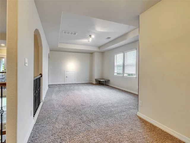 a view of a hallway view with staircase