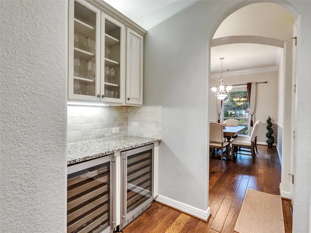 hallway with wooden floor and furniture