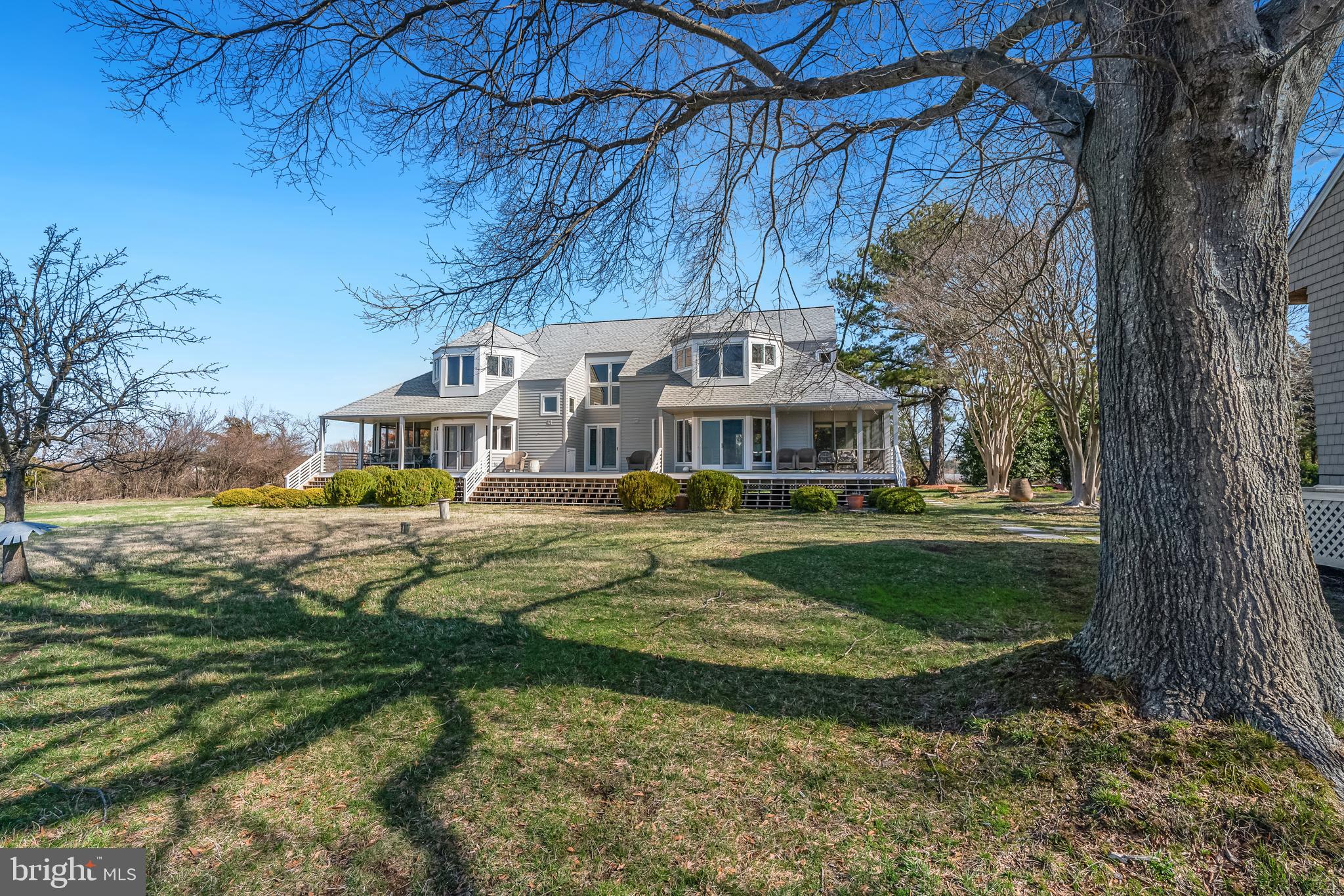 26319 Chanticleer Road Oxford, MD 21654 - Photo 12 of 55 a front view of a house with a yard