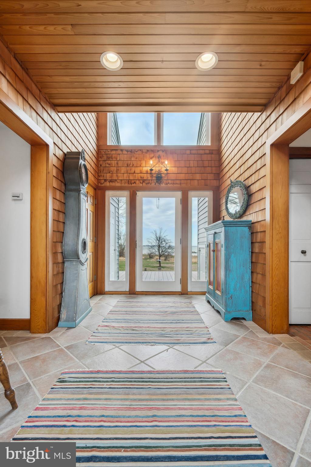 26319 Chanticleer Road Oxford, MD 21654 - Photo 22 of 55 a view of a hallway with wooden floor and a window