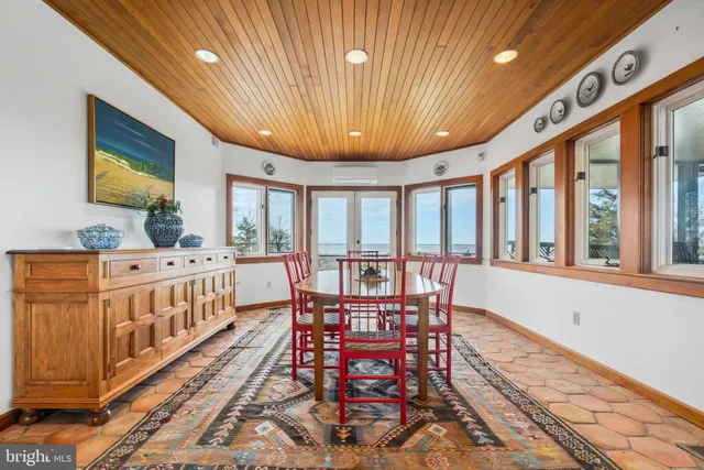 a white house sitting in middle of the forest