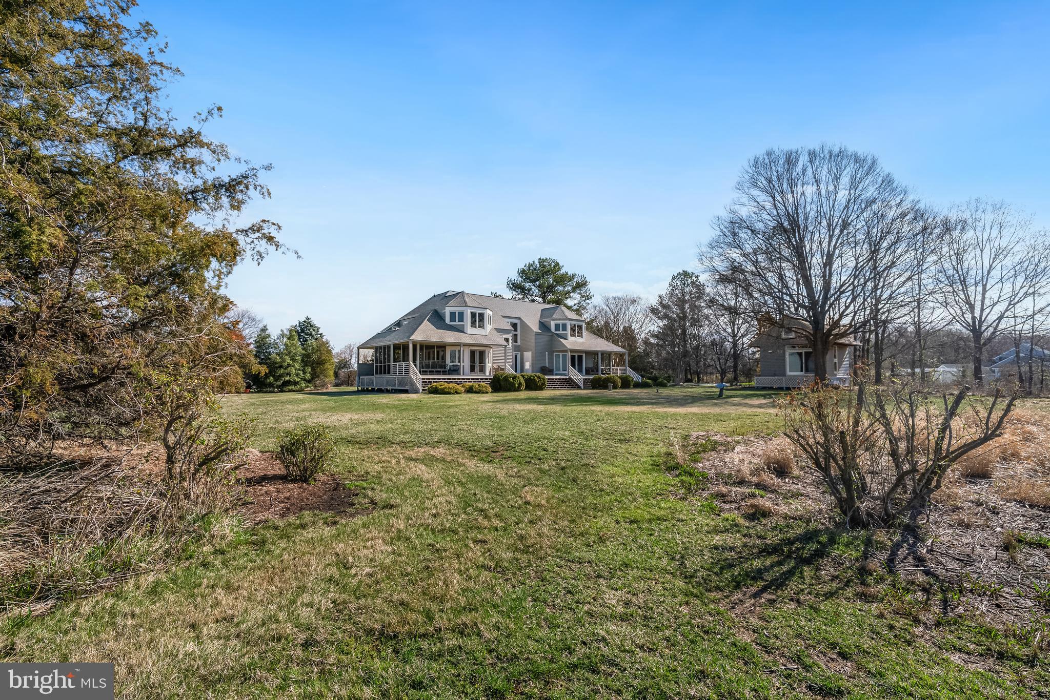 26319 Chanticleer Road Oxford, MD 21654 - Photo 35 of 55 a white house sitting in middle of the forest