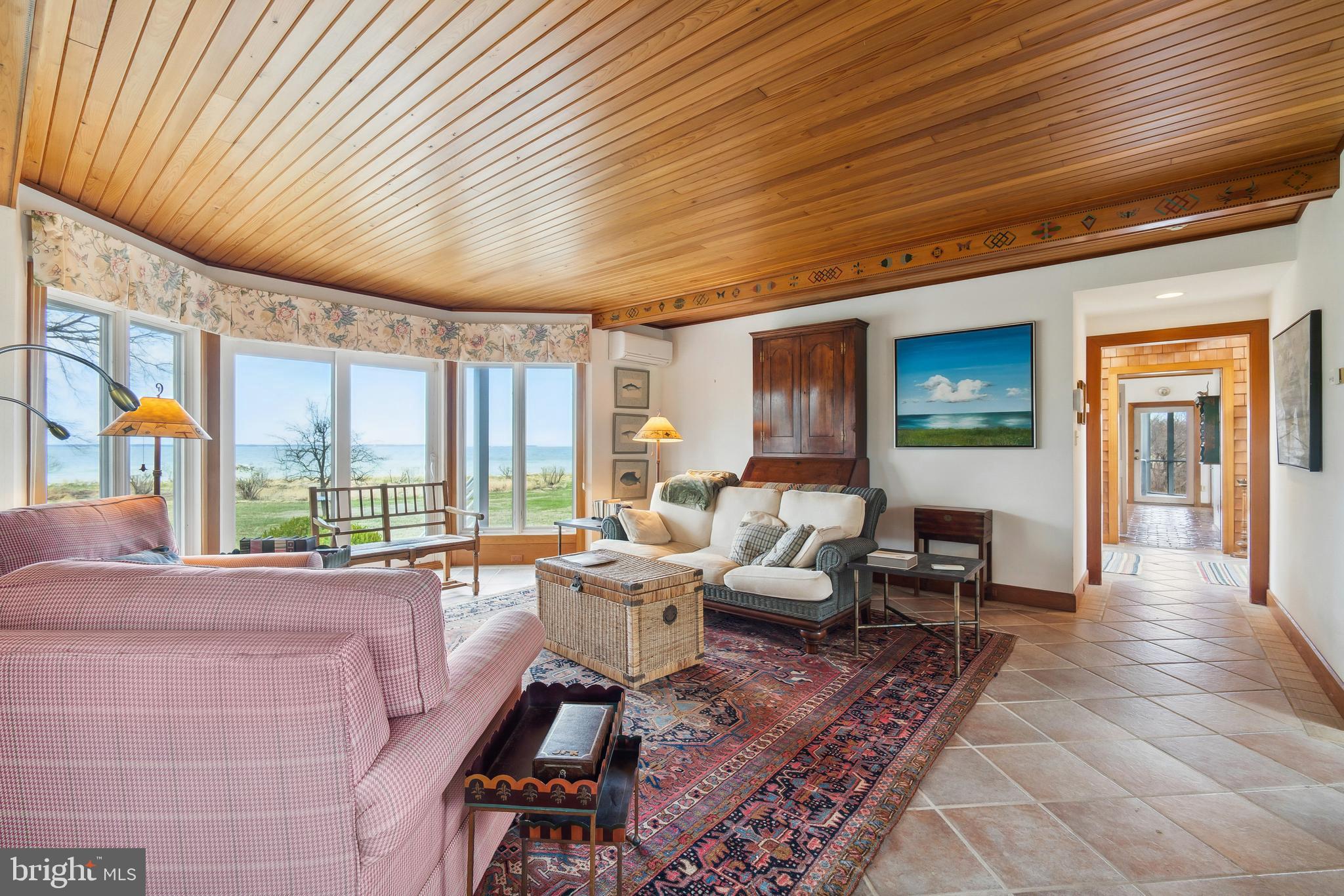 26319 Chanticleer Road Oxford, MD 21654 - Photo 37 of 55 a living room with furniture wooden floor and large window