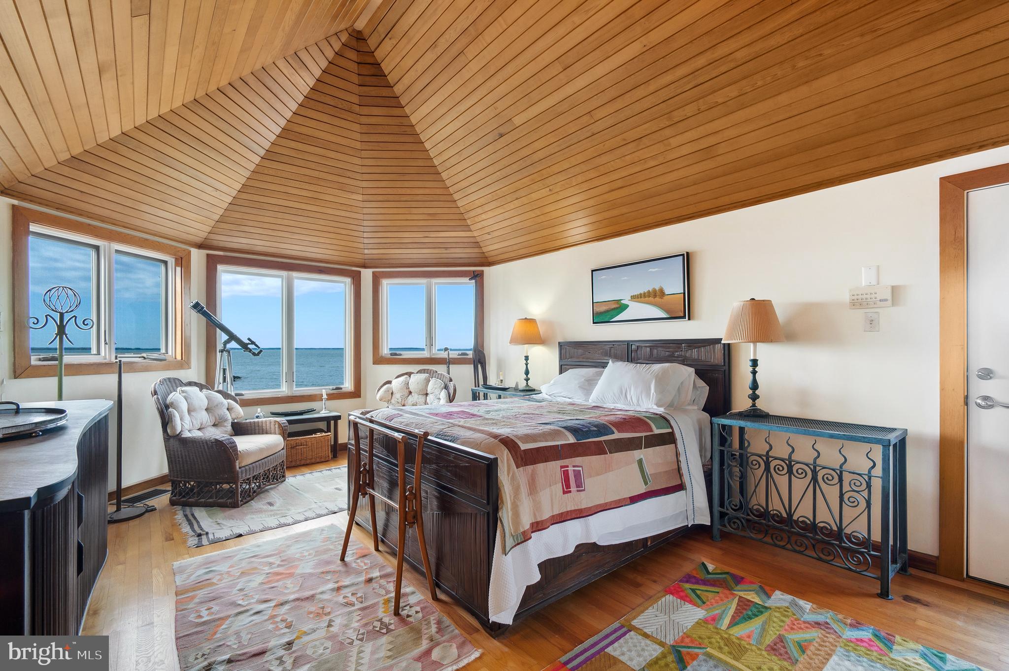 26319 Chanticleer Road Oxford, MD 21654 - Photo 40 of 55 a bed room with a bed and a couch