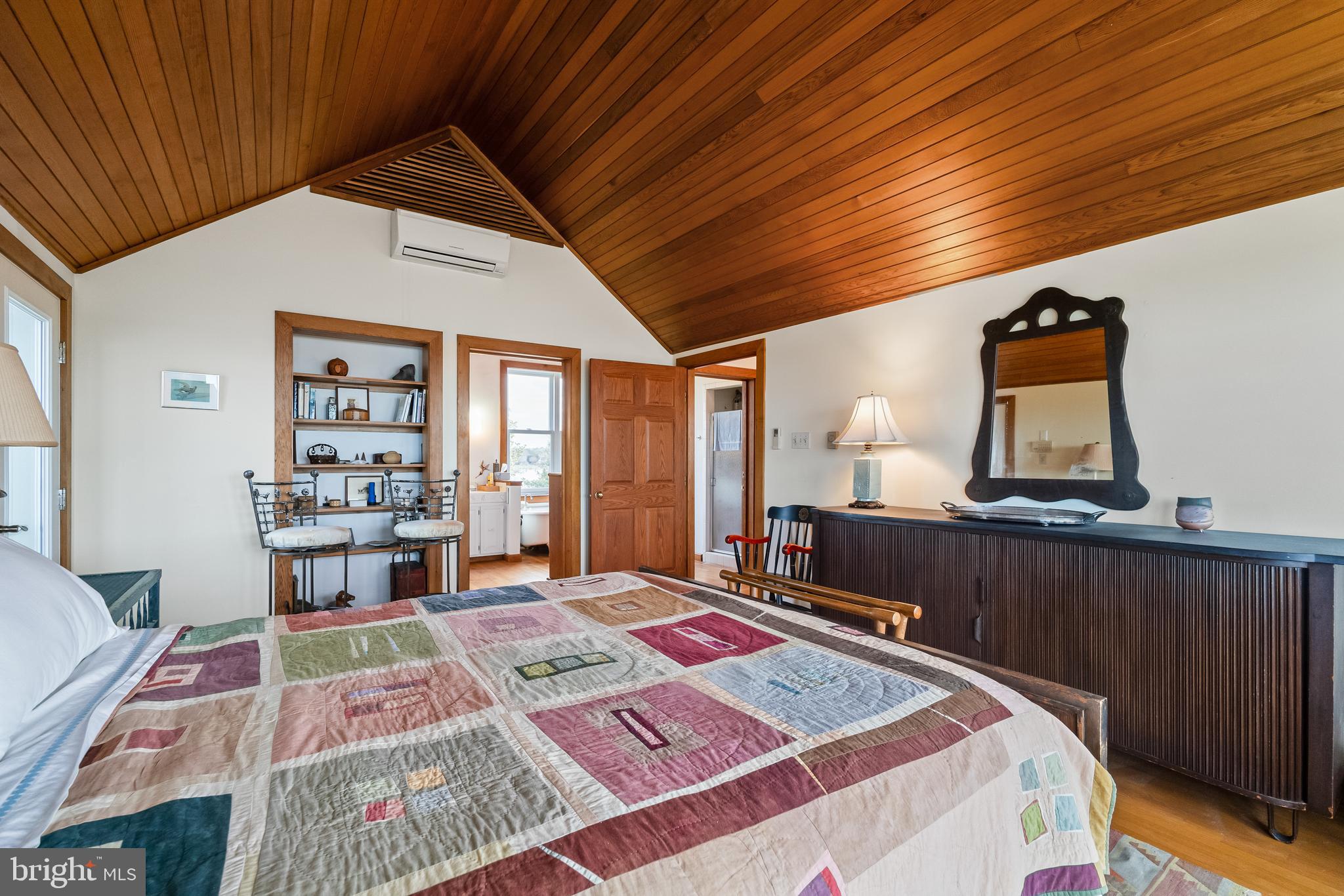 26319 Chanticleer Road Oxford, MD 21654 - Photo 42 of 55 a bedroom with a bed and a large window