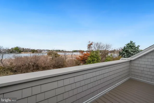 a bedroom with a bed a table and chair
