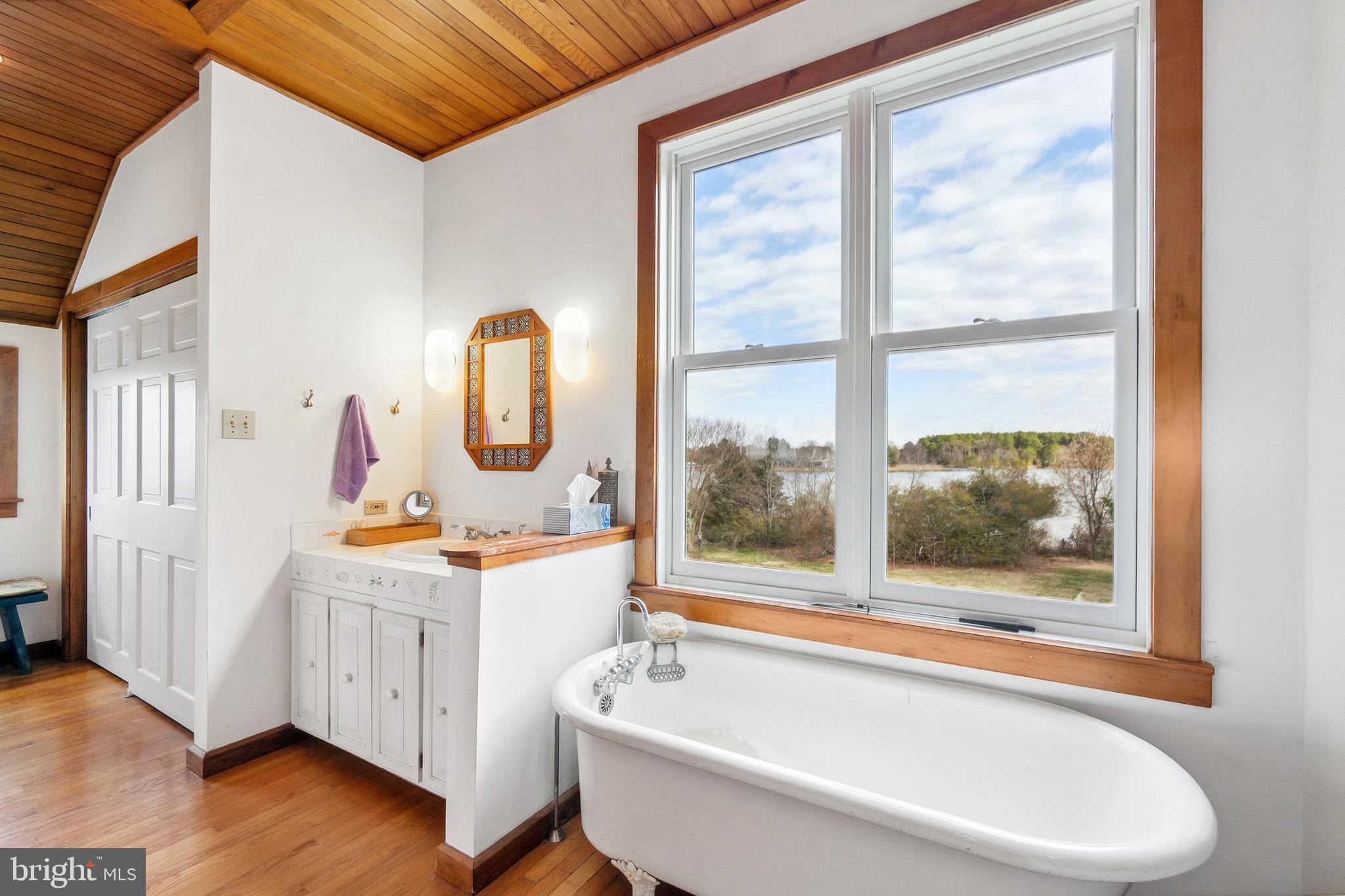 26319 Chanticleer Road Oxford, MD 21654 - Photo 44 of 55 a bathroom with a sink and a large window