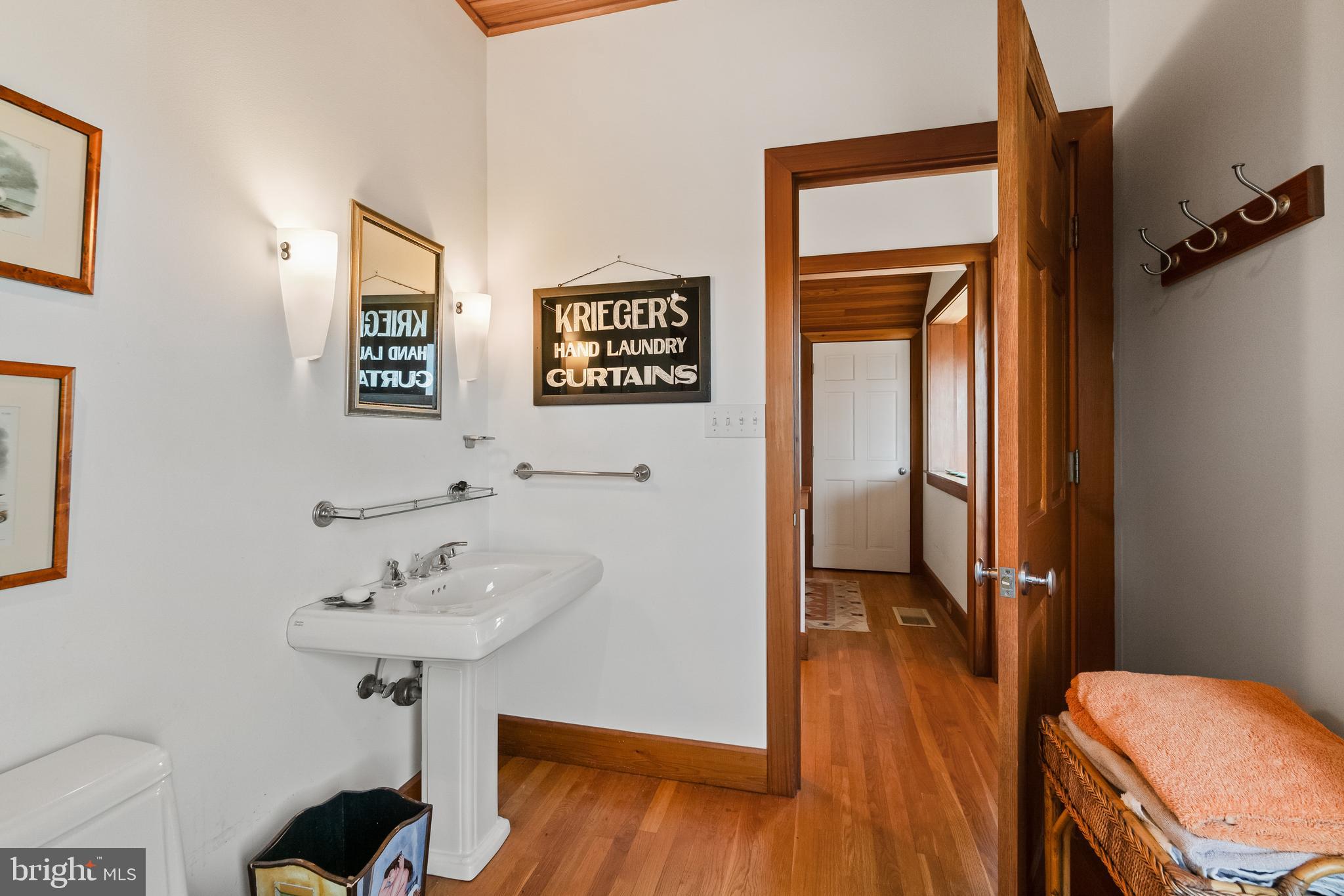 26319 Chanticleer Road Oxford, MD 21654 - Photo 53 of 55 a bathroom with a sink and a mirror