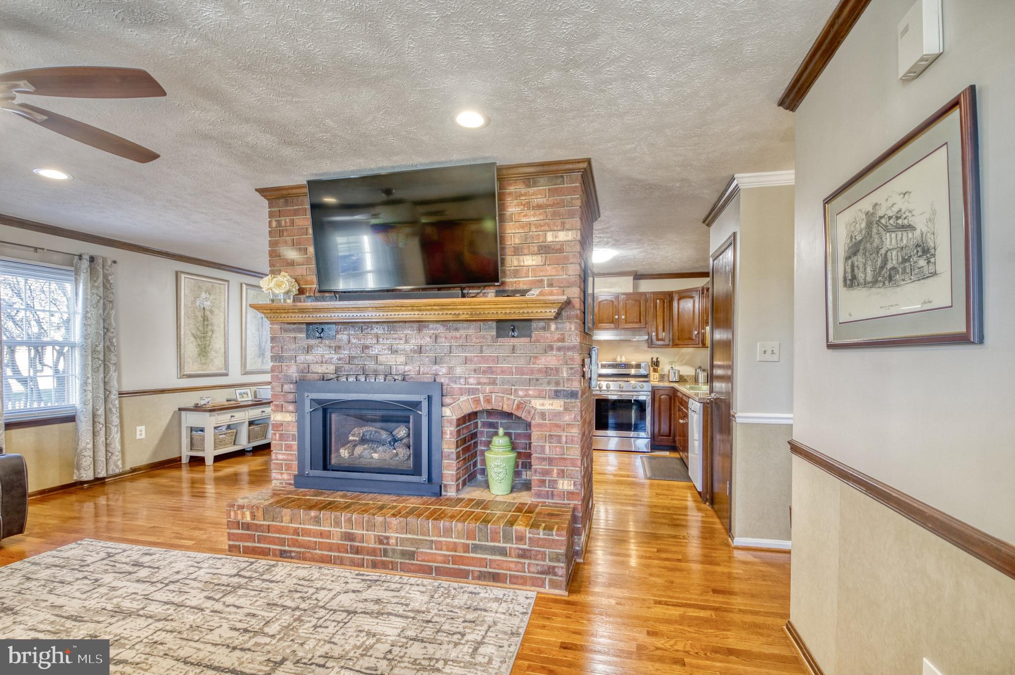 8749 Weems Road Manassas, VA 20110 - Photo 10 of 37 Lovely brick fireplace hearth is the focal point