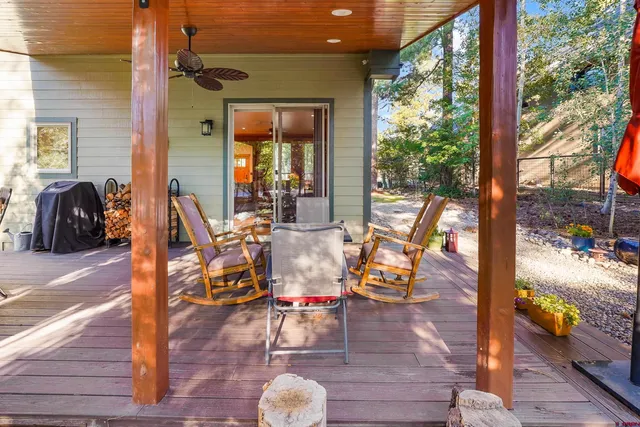 a view of living room with patio furniture and wooden floor