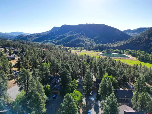 a view of a mountain with a mountain in the background
