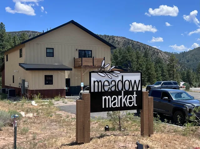 a front view of a house with parking space