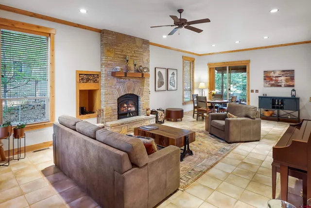 a living room with furniture and a fireplace
