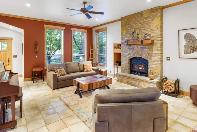 a living room with furniture and a fireplace