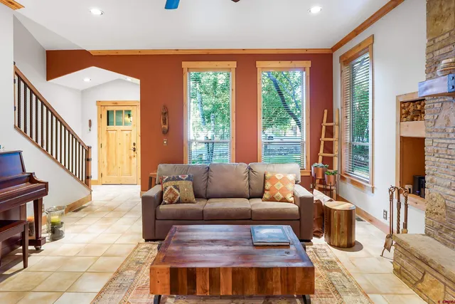 a living room with furniture and a large window