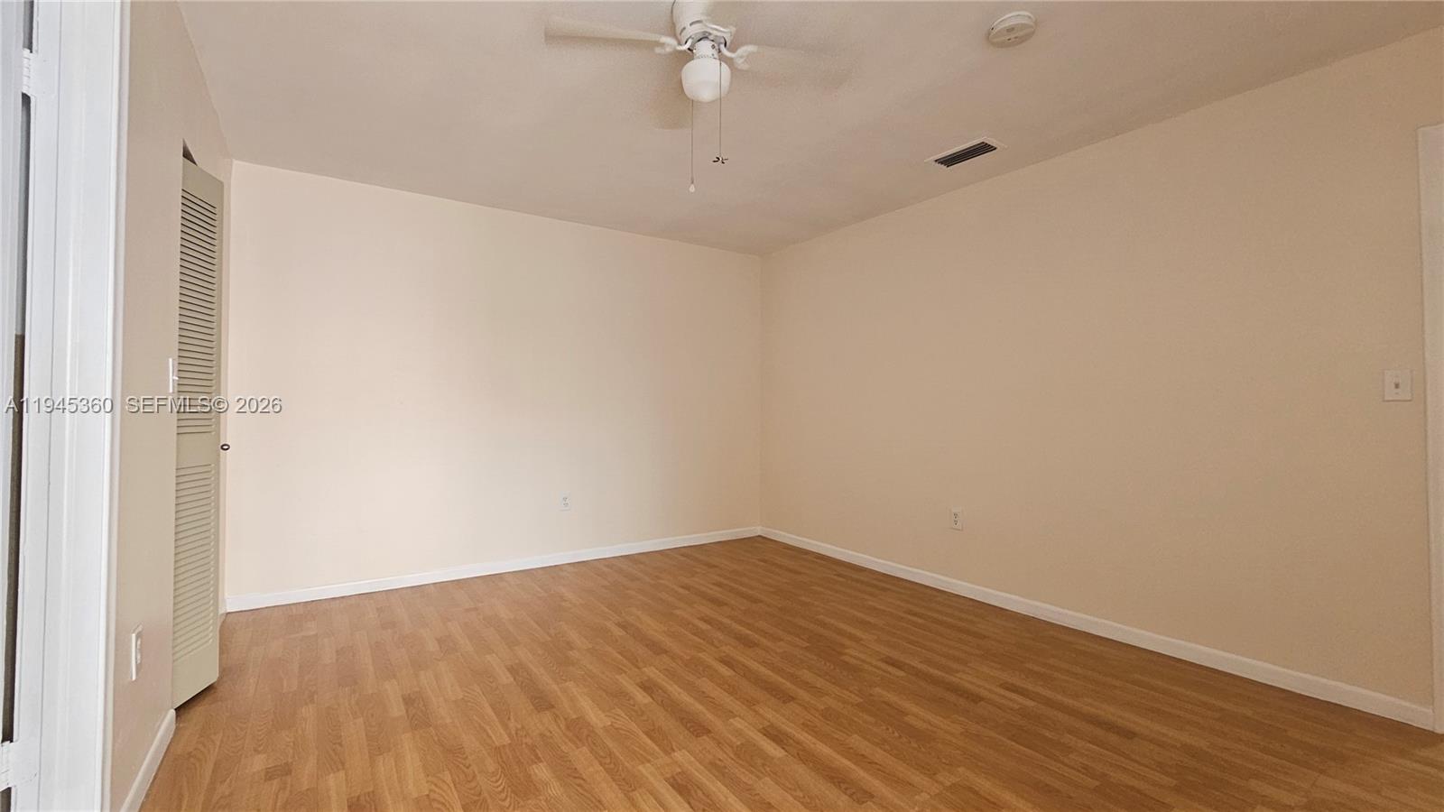 13454 Southwest 62nd Street, Unit 101O Miami, FL 33183 - Photo 12 of 15 a view of a room with wooden floor