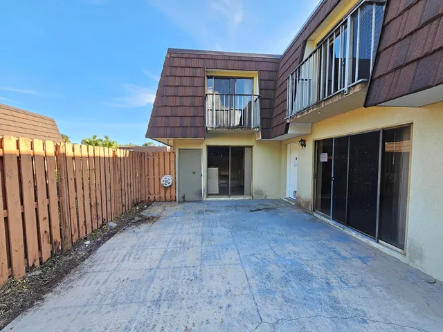 a view of a wooden fence
