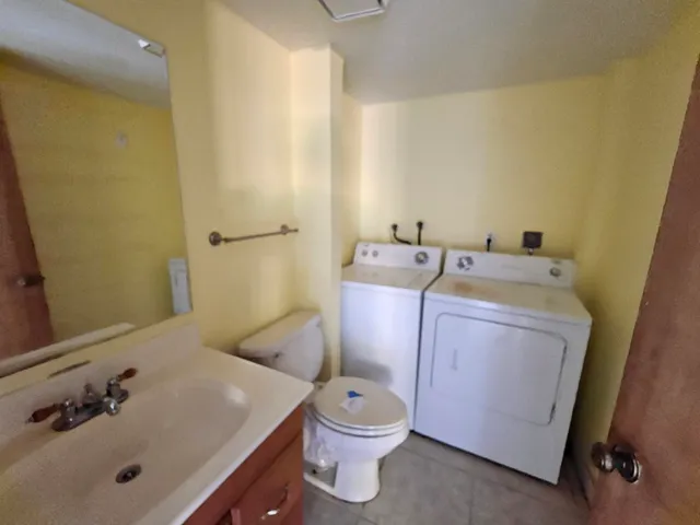 a bathroom with a sink toilet and vanity
