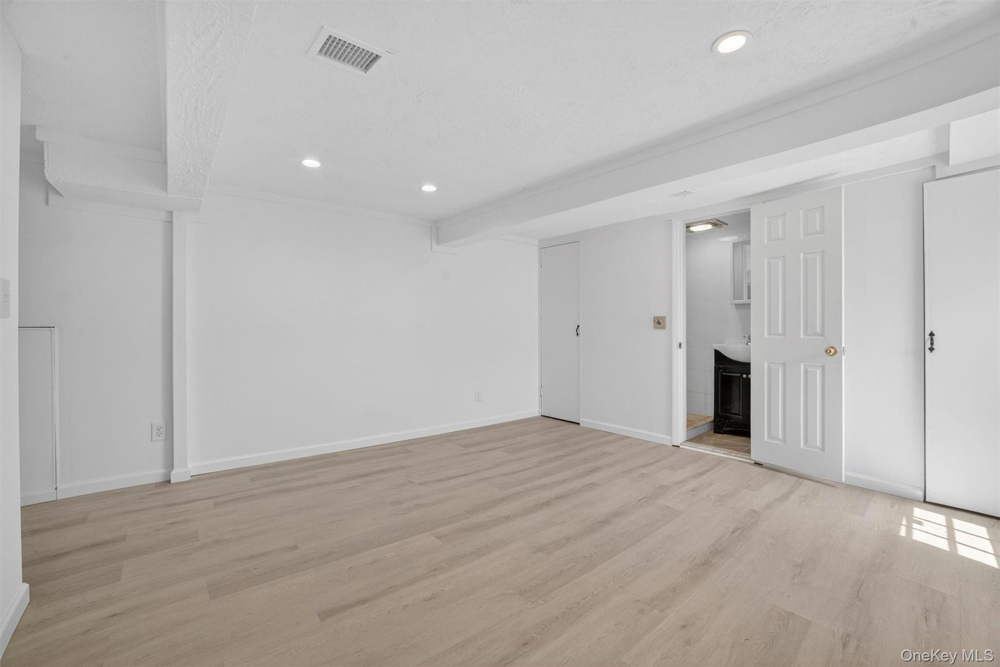 263 Croydon Road Yonkers, NY 10710 - Photo 32 of 43 a view of an empty room with wooden floor