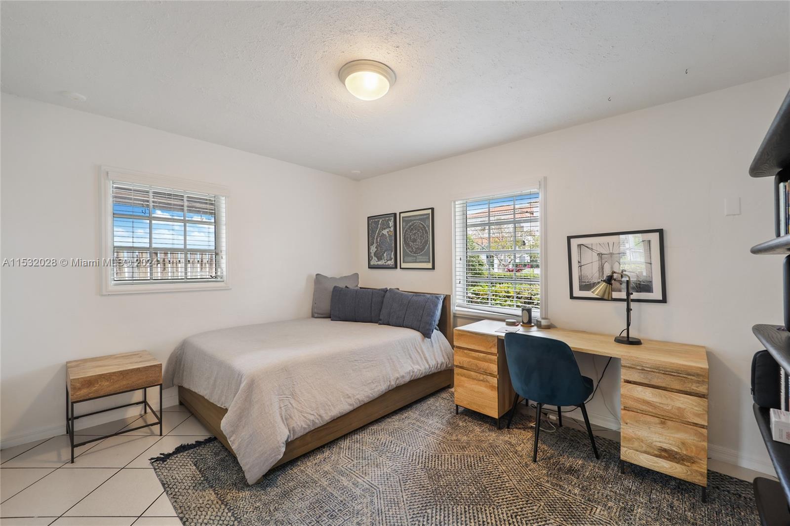 255 Ridgewood Road Key Biscayne, FL 33149 - Photo 12 of 18 a bedroom with a bed and a desk