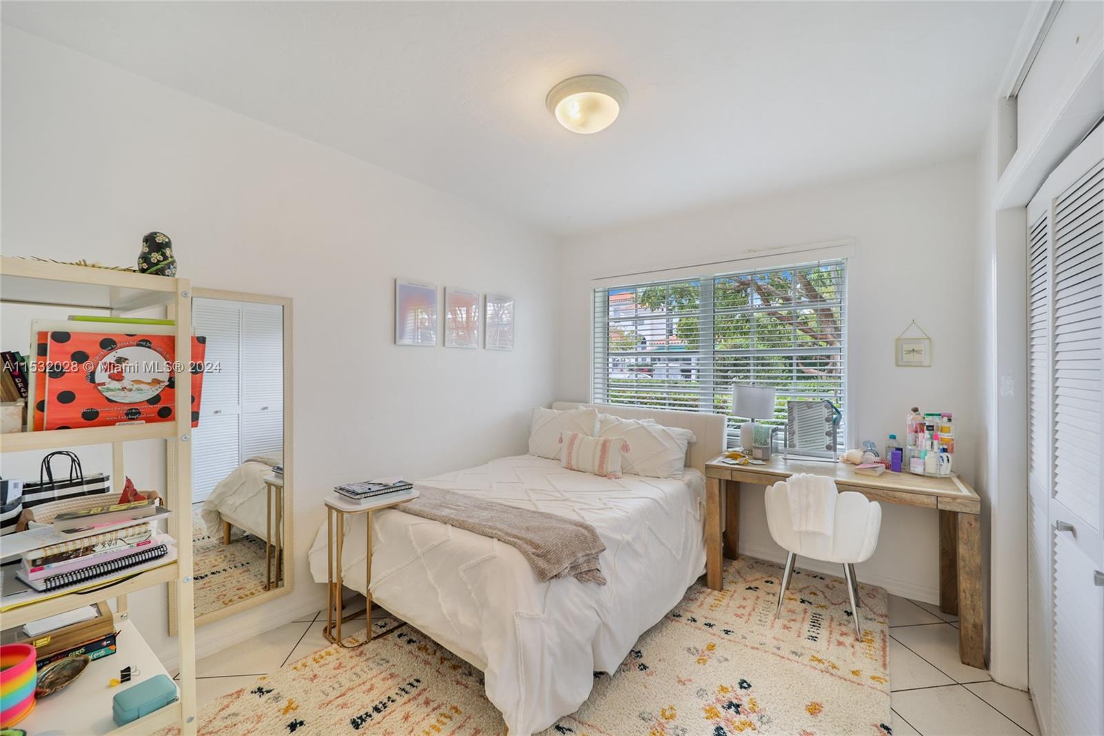 255 Ridgewood Road Key Biscayne, FL 33149 - Photo 13 of 18 a bedroom with a bed and a couch