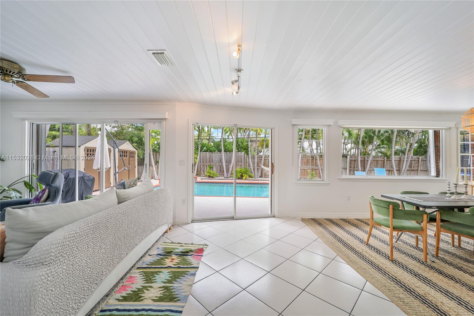 255 Ridgewood Road Key Biscayne, FL 33149 - Photo 5 of 18 a bed room with a bed and a chair