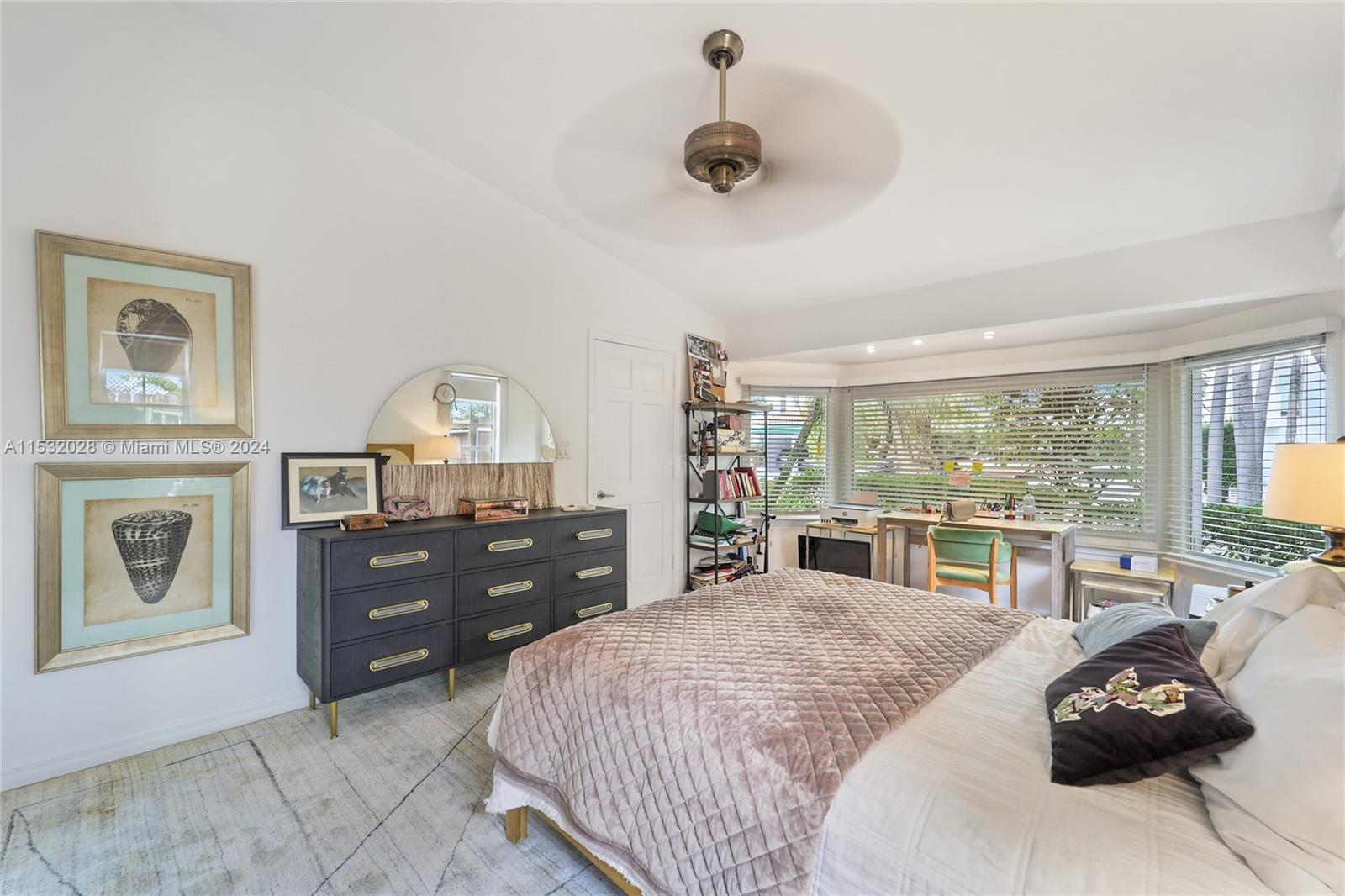 255 Ridgewood Road Key Biscayne, FL 33149 - Photo 10 of 18 a bedroom with a bed and wooden floor