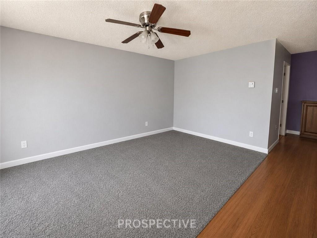 215 Maple Street Kittanning, PA 16201 - Photo 5 of 39 wooden floor in an empty room with a window