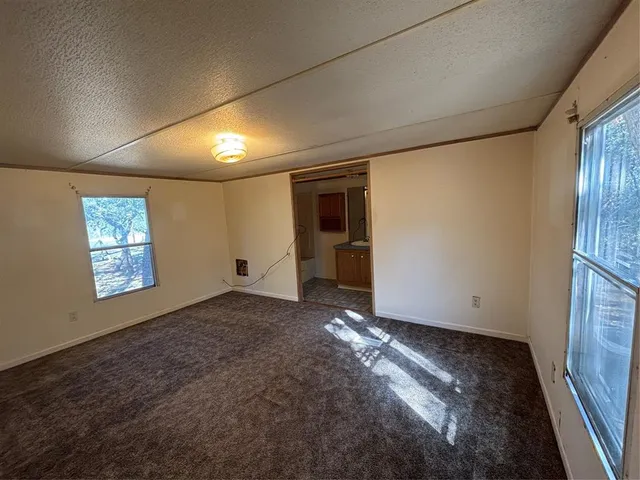a view of an empty room and window