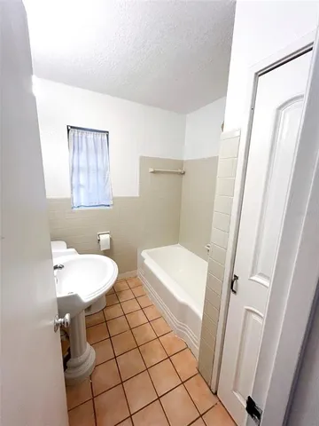 a bathroom with a sink a toilet a mirror and vanity