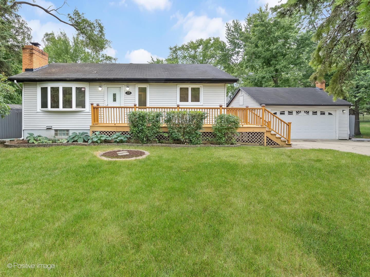 335 Oldfield Road Darien, IL 60561 - Photo 1 of 33 a view of a house with a yard and sitting area