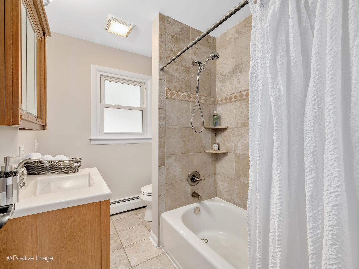 335 Oldfield Road Darien, IL 60561 - Photo 18 of 33 a bathroom with a sink a bathtub and a shower