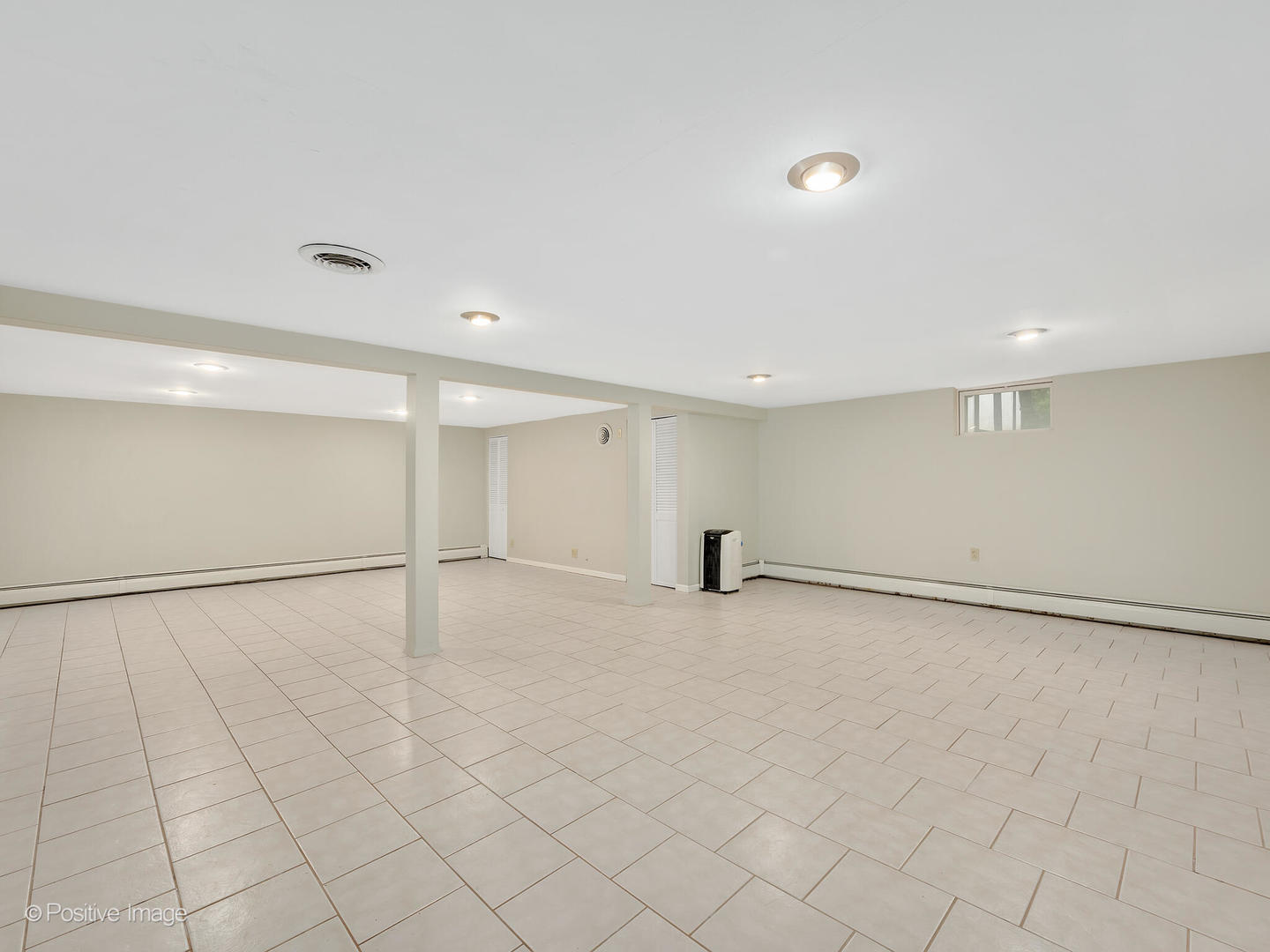 335 Oldfield Road Darien, IL 60561 - Photo 19 of 33 an empty room with white walls and tiles