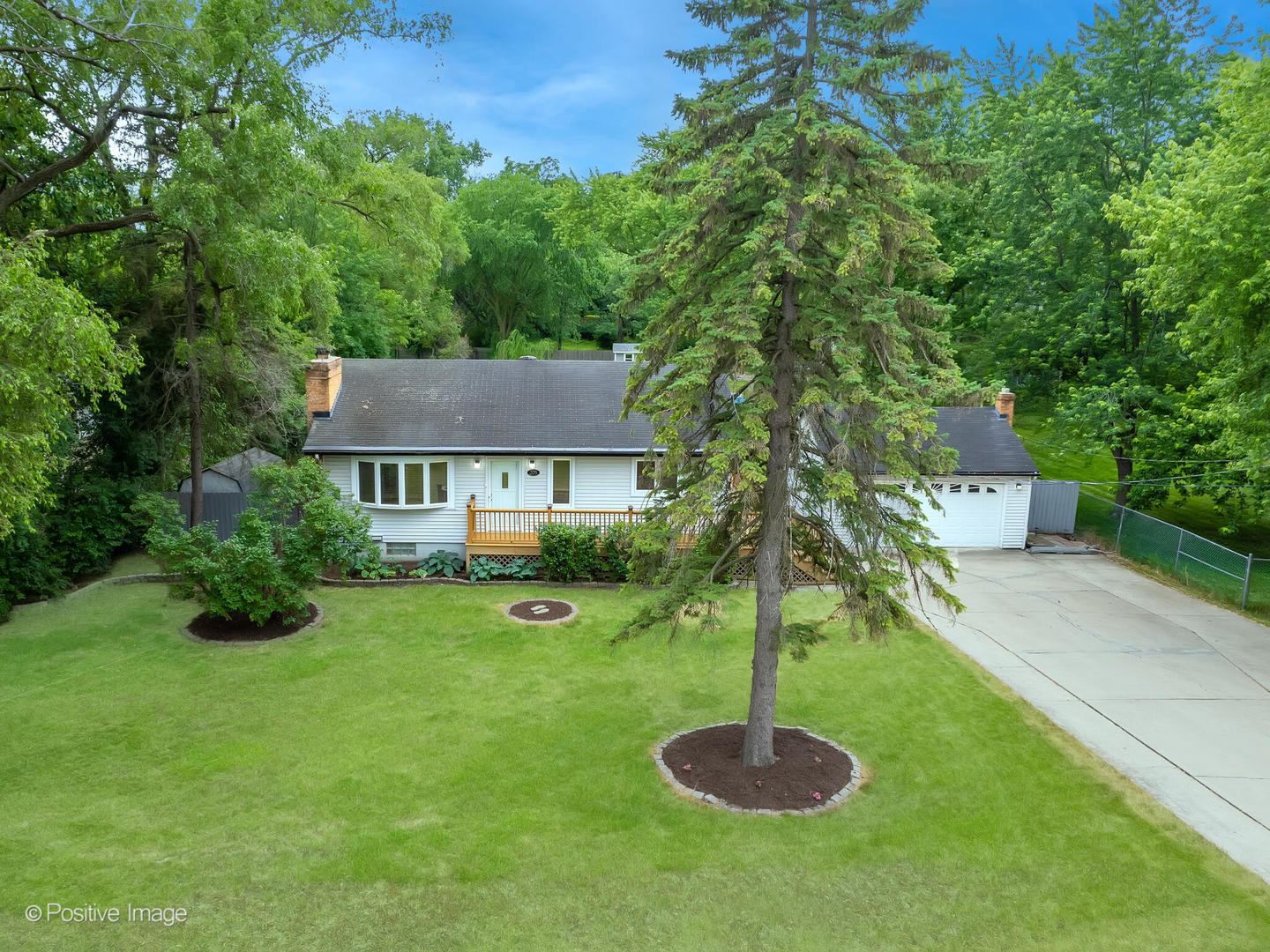 335 Oldfield Road Darien, IL 60561 - Photo 2 of 33 a swimming pool with outdoor seating and yard
