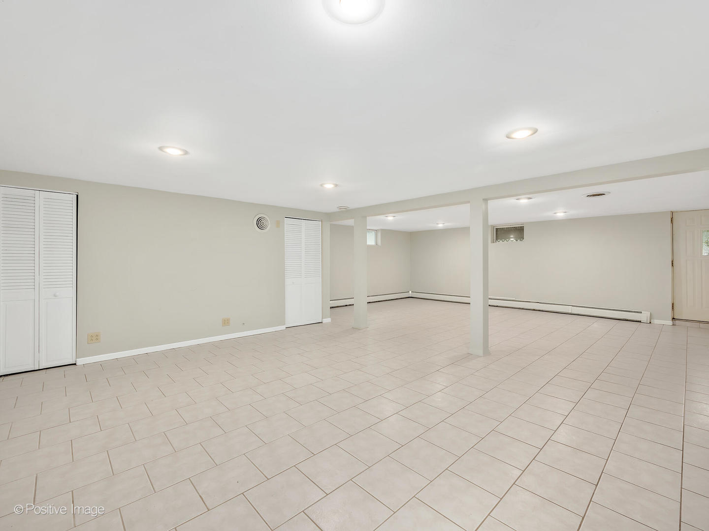 335 Oldfield Road Darien, IL 60561 - Photo 21 of 33 an empty room with white walls and tiles