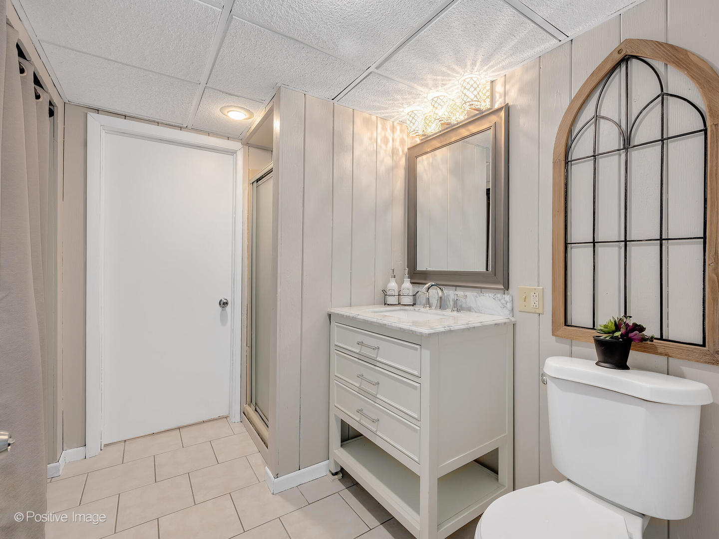 335 Oldfield Road Darien, IL 60561 - Photo 23 of 33 a bathroom with a sink a toilet a mirror and shower