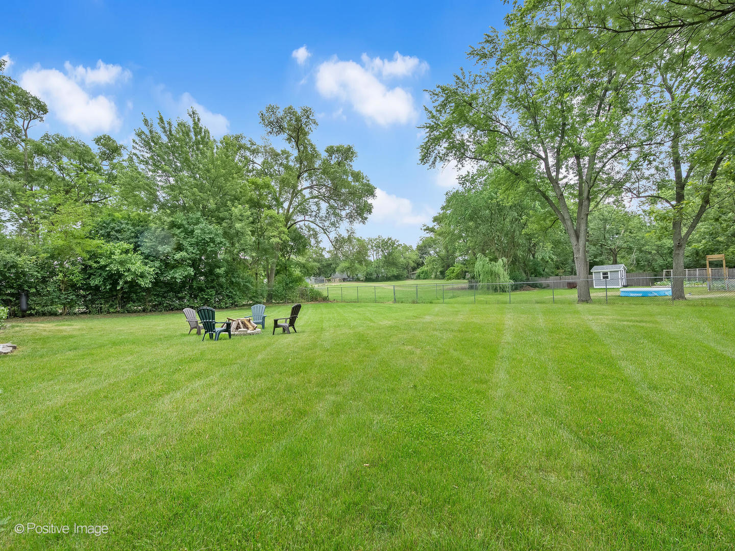 335 Oldfield Road Darien, IL 60561 - Photo 29 of 33 a garden with trees in the background
