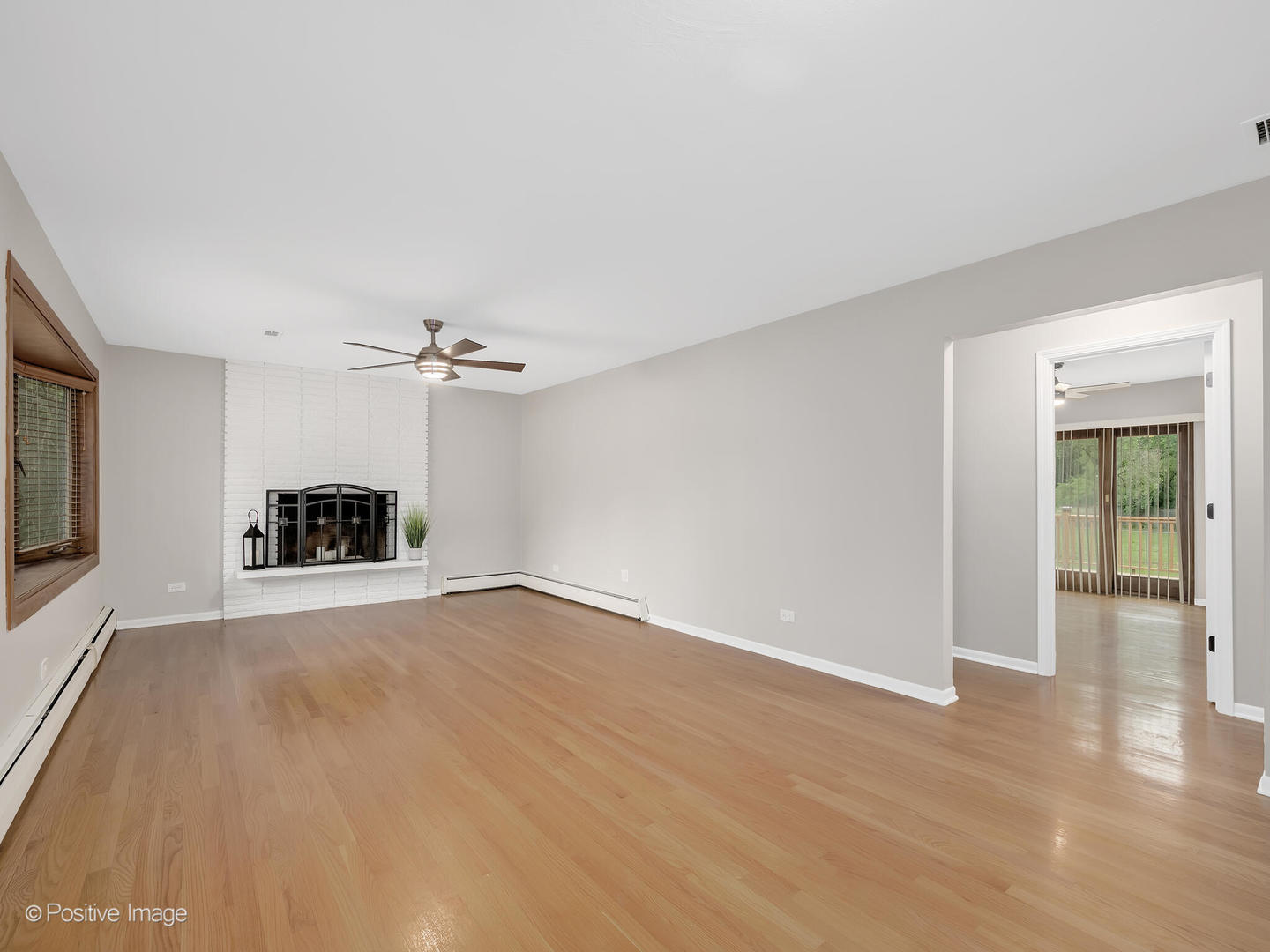 335 Oldfield Road Darien, IL 60561 - Photo 6 of 33 wooden floor in an empty room with a window