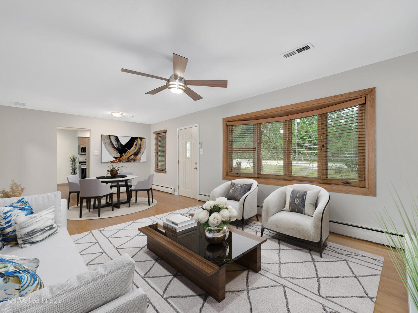 335 Oldfield Road Darien, IL 60561 - Photo 7 of 33 a living room with furniture and a large window