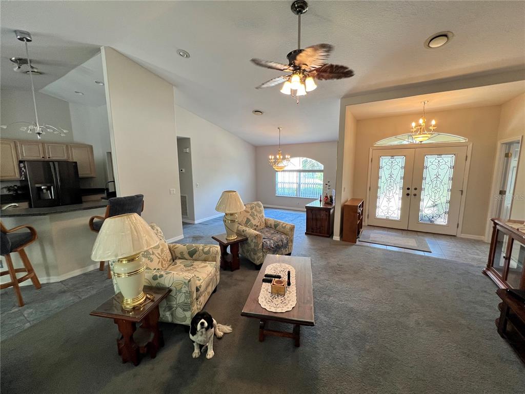 1995 East Newhaven Street Inverness, FL 34453 - Photo 12 of 48 a view of a livingroom with furniture and a chandelier